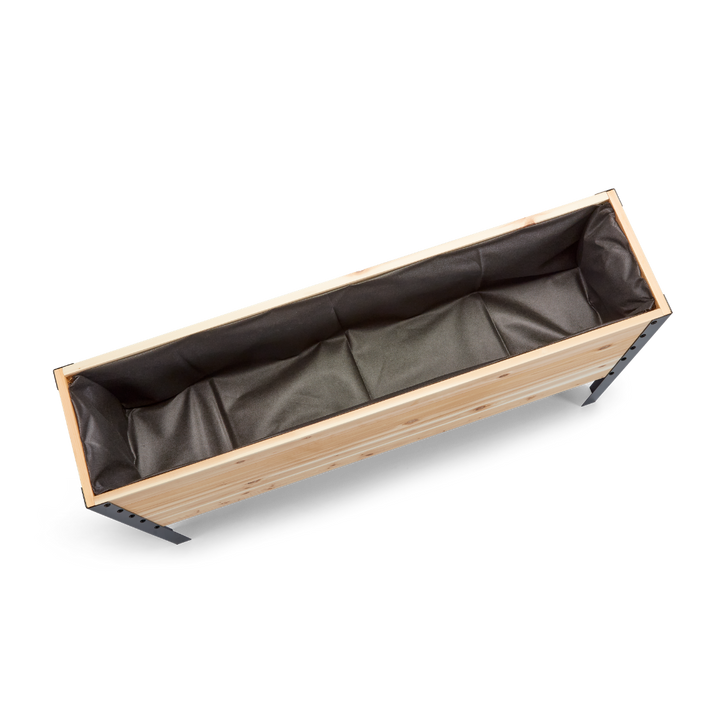 Wooden planter box with black interior on a white background